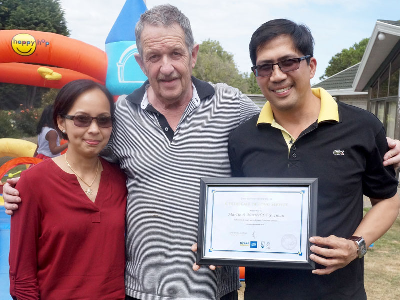 Martin and Maricel deGuzman receive their 3-year Certificate of Long Service Award from Glenn Cockroft.