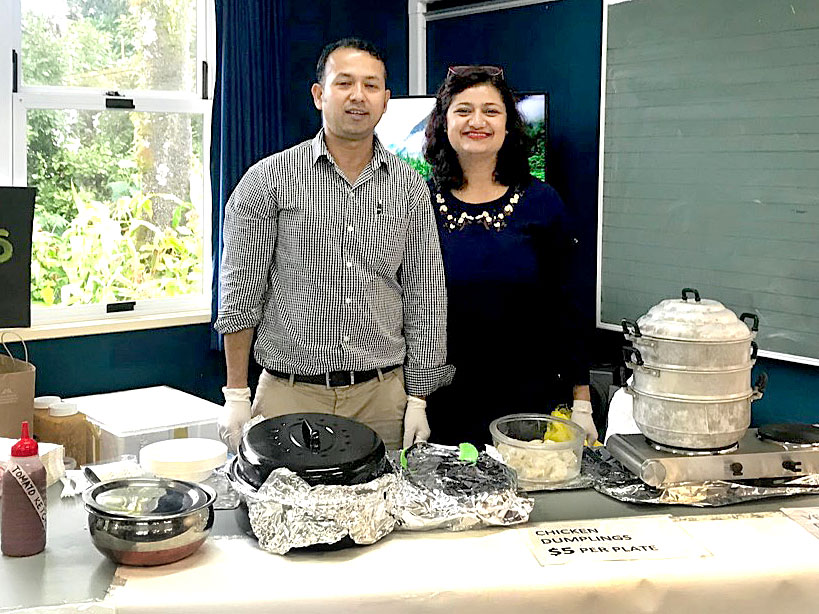 Prasun Acharya and his wife Diksha Niraula spent hours cooking dumplings for a school’s fundraiser. 