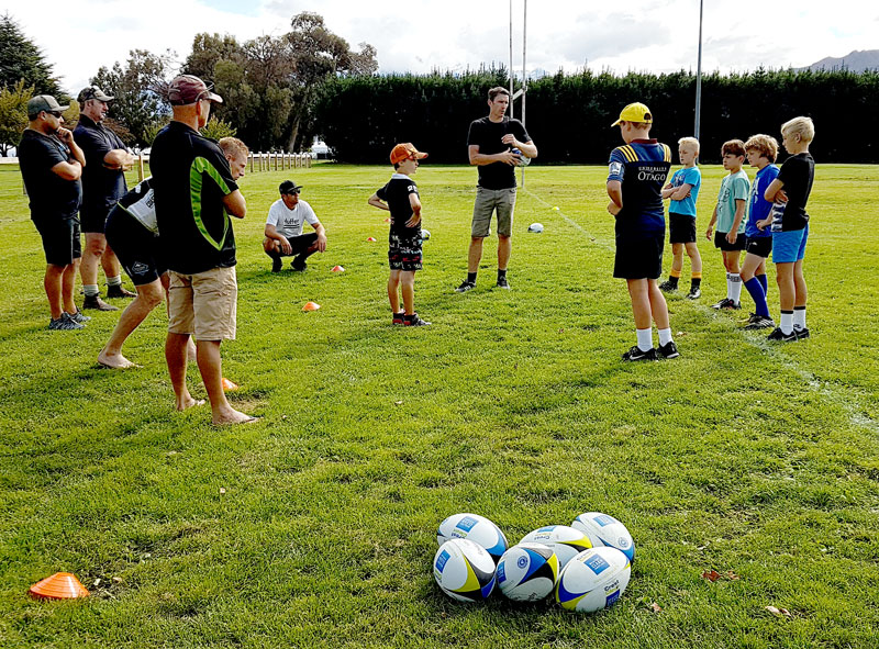 A team talk before training gets under way at the Queenstown and Arrowtown. coaching sessions. 