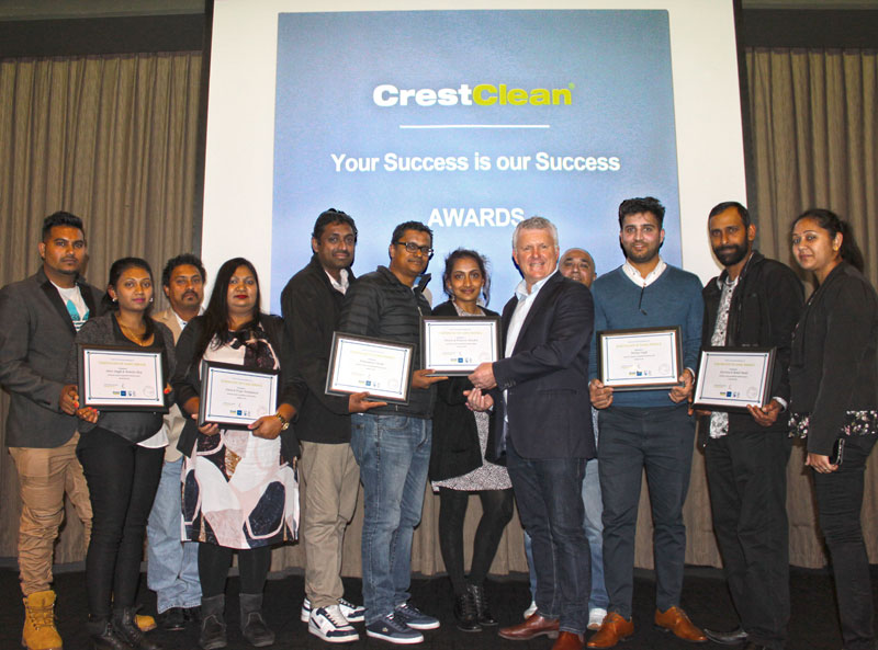 Three-year long service recipients receive their certificates from Grant McLauchlan, CrestClean’s managing director at the Auckland Team Meeting. 