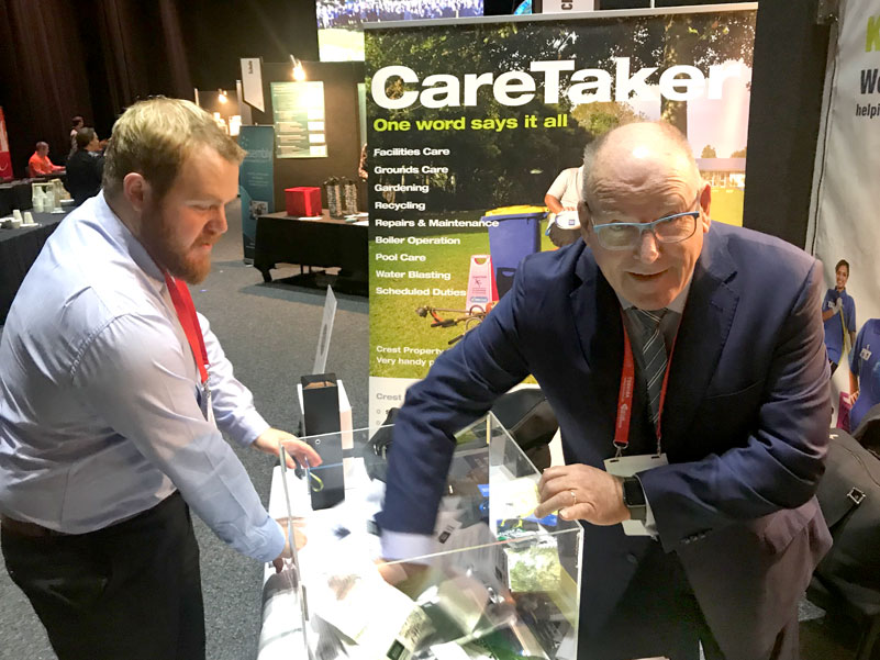 Paul Ferris, CEO of the Catholic Education Convention makes the prize draw on the CrestClean stand. Looking on is Sam Creasy, CrestClean’s National Accounts Manager. 