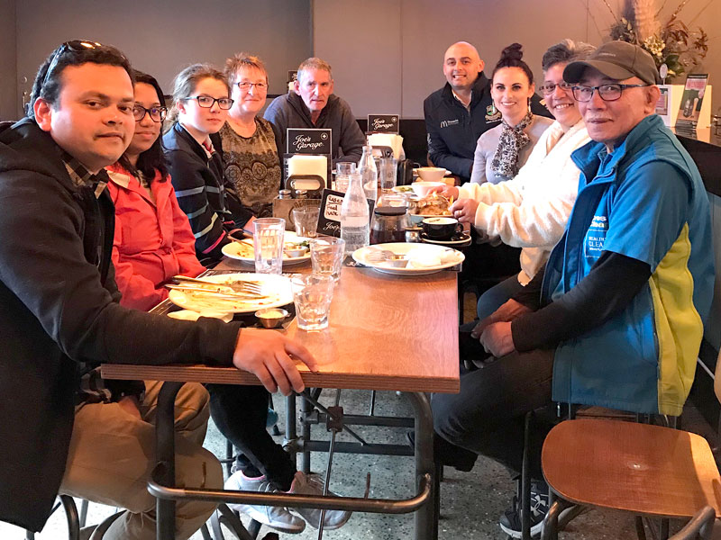 Owen and Carolyn Smithson (centre) with their CrestClean Dunedin collegues at a farewell lunch. 