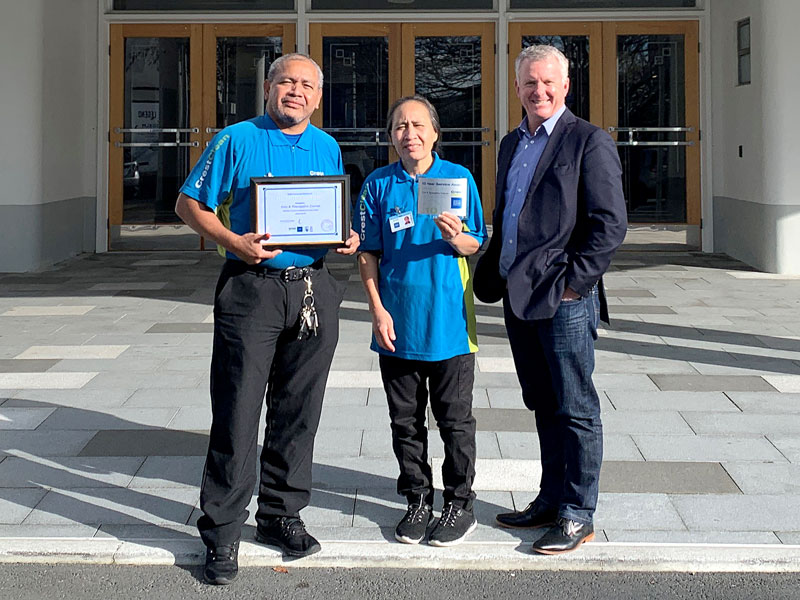 Poni and Tau Faavae receive their long service award from Grant McLauchlan, CrestClean’s Managing Director.