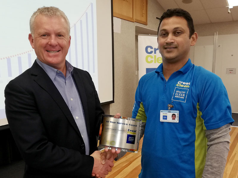 Praneel Prasad receives his 10-year long service award from Grant McLauchlan, CrestClean’s Managing Director. 