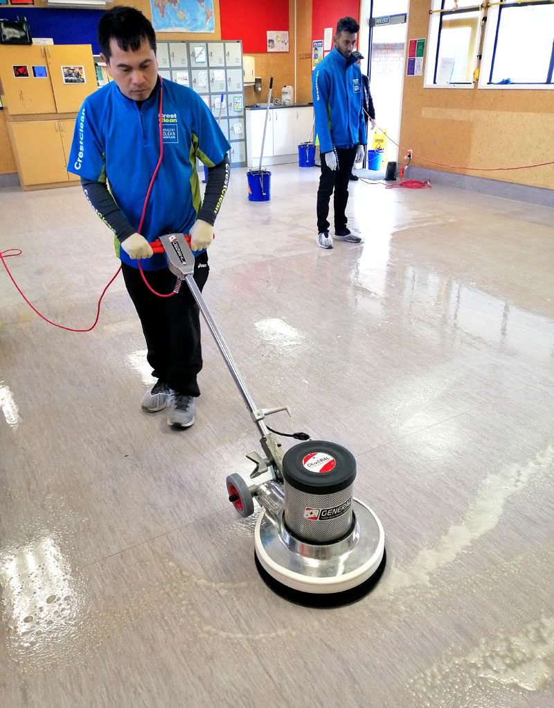 Jande Ganas learns how to strip a vinyl floor.