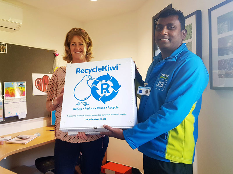 Naresh Mani presents a RecycleKiwi pack to Leanne Hanna, Principal's PA/Office Manager at Red Beach School. 